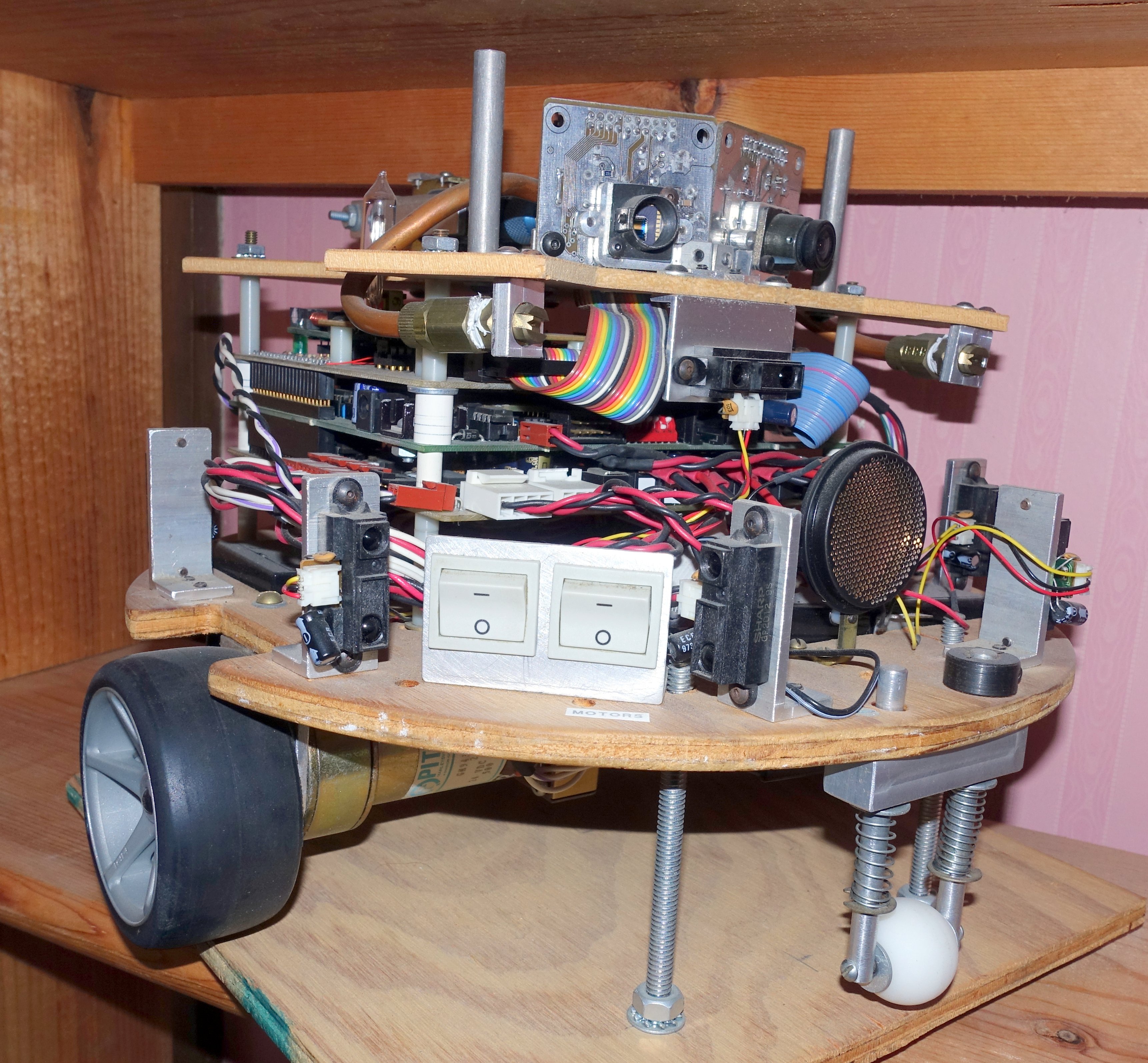Third entry - compressed CO2 for extinguishing flame, wheels directly driven by gear motors with encoders, 9 infrared range sensors, UV sensors and computer vision for flame detection, custom printed circuit boards